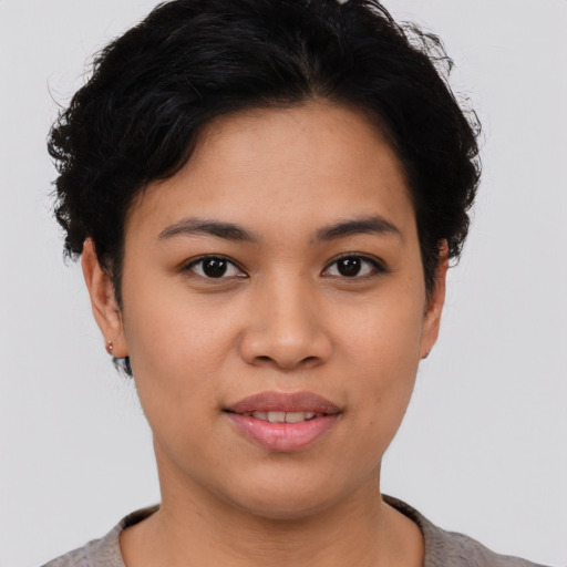 Joyful asian young-adult female with short  brown hair and brown eyes