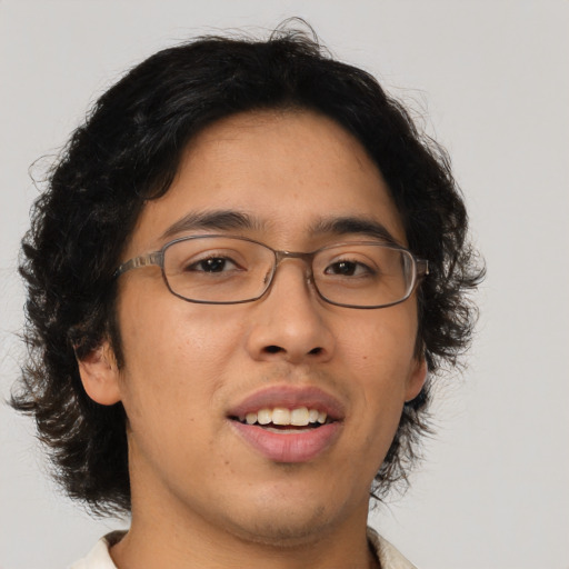 Joyful asian young-adult male with medium  brown hair and brown eyes