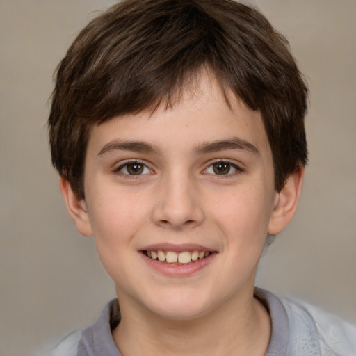 Joyful white child male with short  brown hair and brown eyes