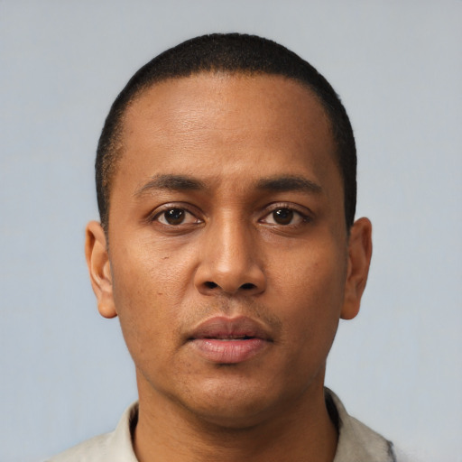 Neutral black young-adult male with short  black hair and brown eyes