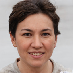 Joyful white adult female with short  brown hair and brown eyes