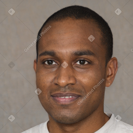 Joyful black young-adult male with short  brown hair and brown eyes