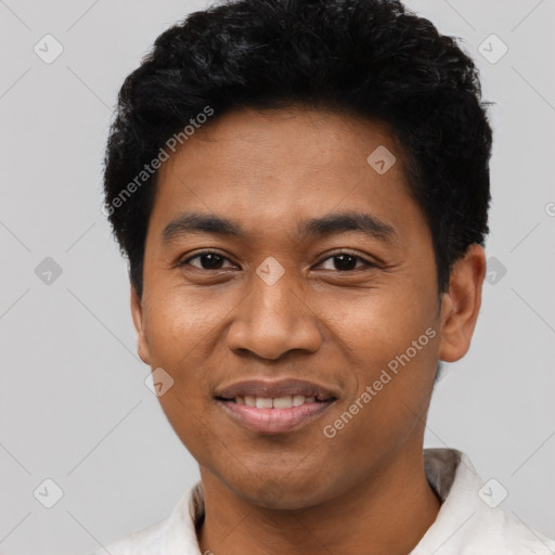 Joyful latino young-adult male with short  black hair and brown eyes