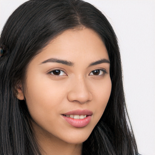 Joyful asian young-adult female with long  brown hair and brown eyes