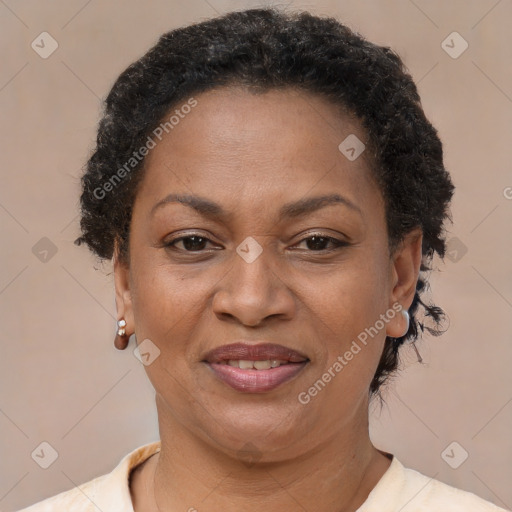 Joyful black adult female with short  brown hair and brown eyes