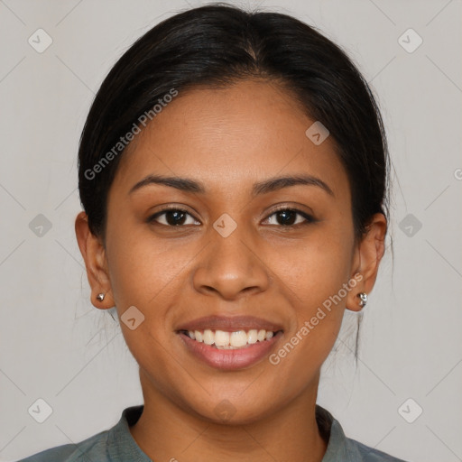 Joyful latino young-adult female with medium  brown hair and brown eyes