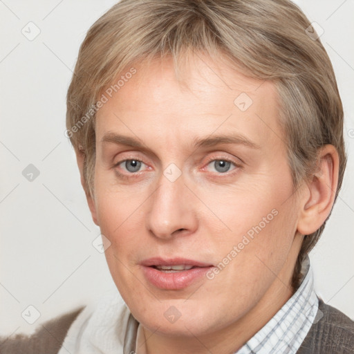 Joyful white adult female with short  brown hair and brown eyes