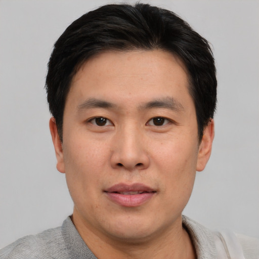 Neutral asian young-adult male with short  black hair and brown eyes