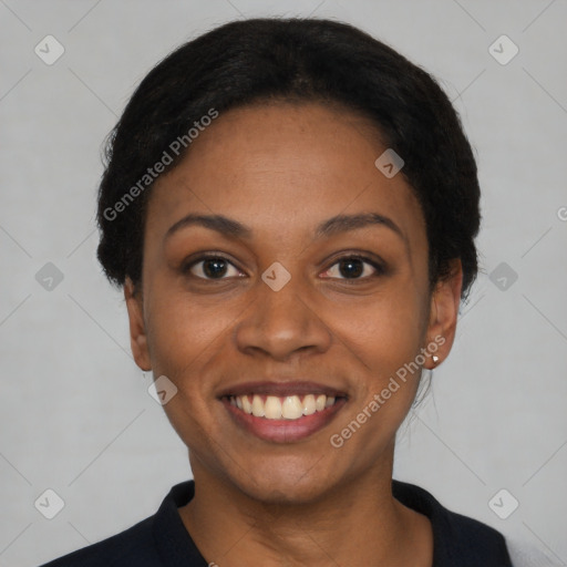 Joyful black young-adult female with short  black hair and brown eyes