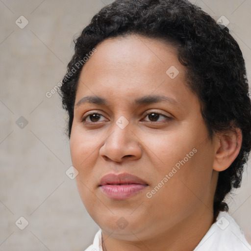 Joyful latino young-adult female with short  brown hair and brown eyes