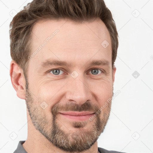 Joyful white adult male with short  brown hair and grey eyes