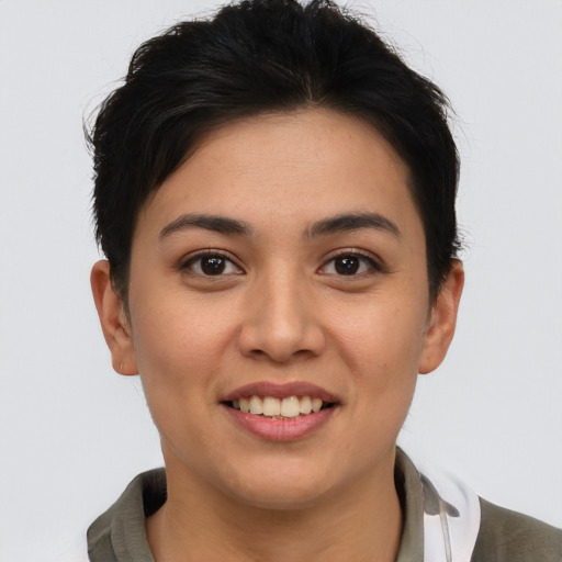 Joyful asian young-adult female with short  brown hair and brown eyes