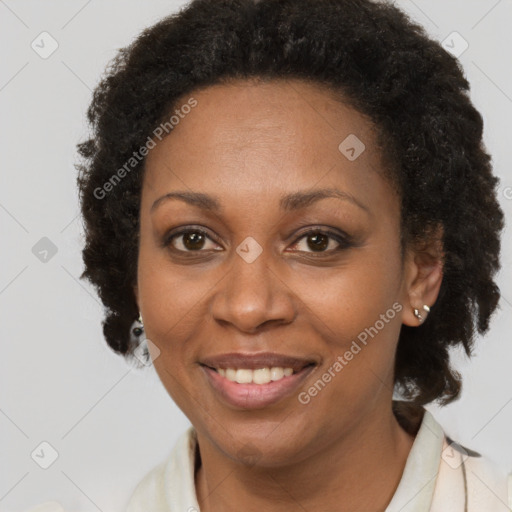 Joyful black adult female with short  brown hair and brown eyes