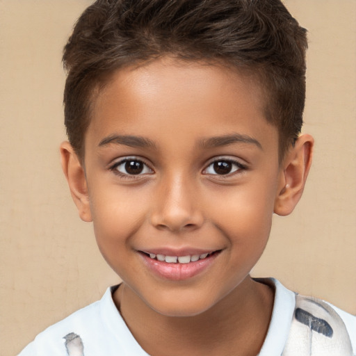 Joyful white child male with short  brown hair and brown eyes