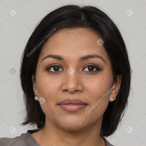 Joyful latino young-adult female with medium  brown hair and brown eyes