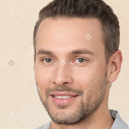 Joyful white young-adult male with short  brown hair and brown eyes