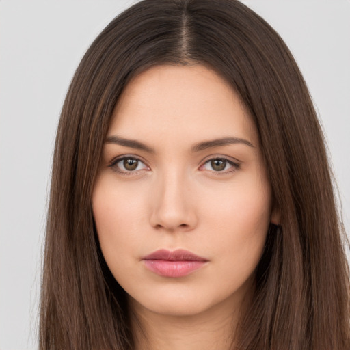 Neutral white young-adult female with long  brown hair and brown eyes