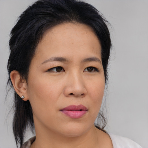 Neutral asian young-adult female with medium  black hair and brown eyes