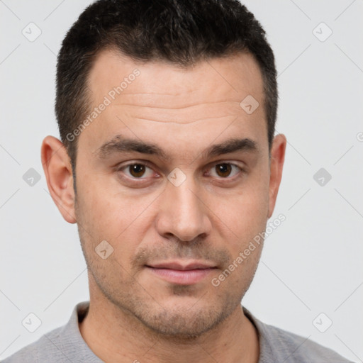 Joyful white young-adult male with short  brown hair and brown eyes