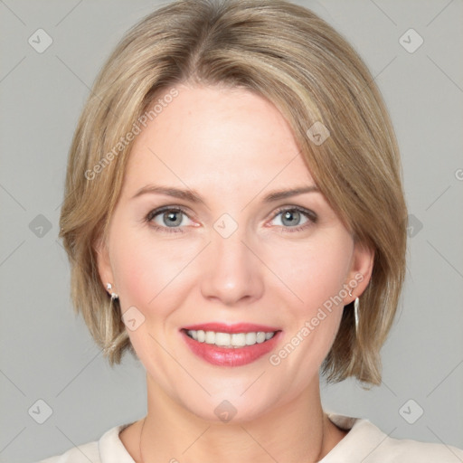 Joyful white young-adult female with medium  brown hair and blue eyes