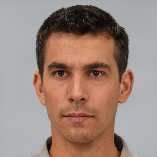 Neutral white young-adult male with short  brown hair and brown eyes