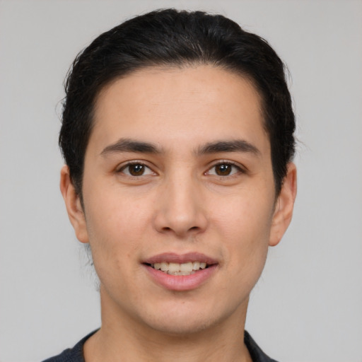 Joyful white young-adult male with short  brown hair and brown eyes