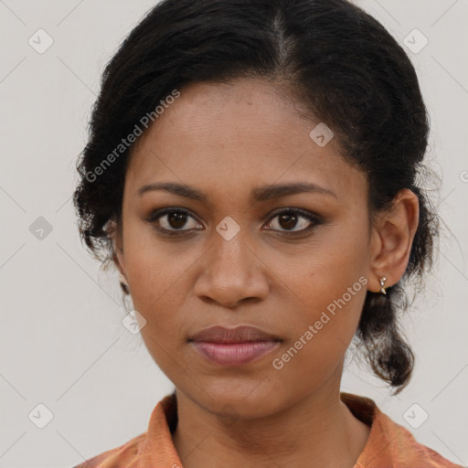 Joyful black young-adult female with long  brown hair and brown eyes