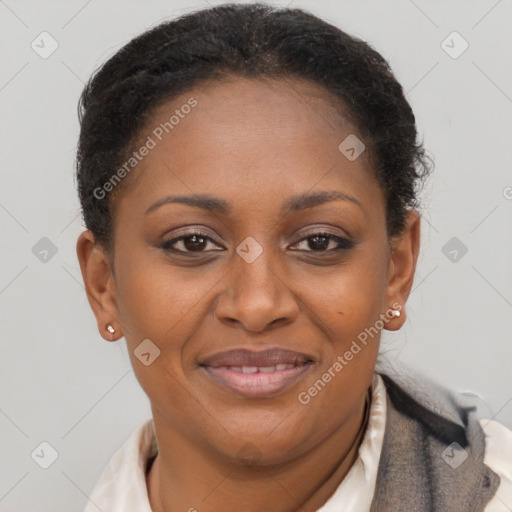 Joyful black adult female with short  brown hair and brown eyes