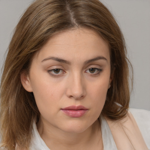 Neutral white young-adult female with medium  brown hair and brown eyes