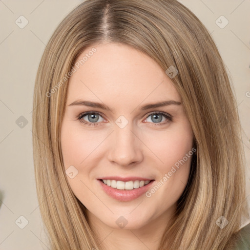 Joyful white young-adult female with long  brown hair and green eyes