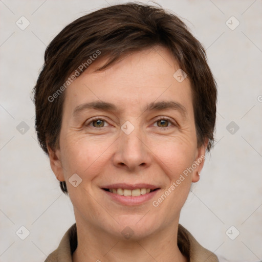 Joyful white adult female with short  brown hair and grey eyes