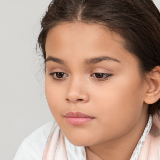 Joyful white child female with medium  brown hair and brown eyes