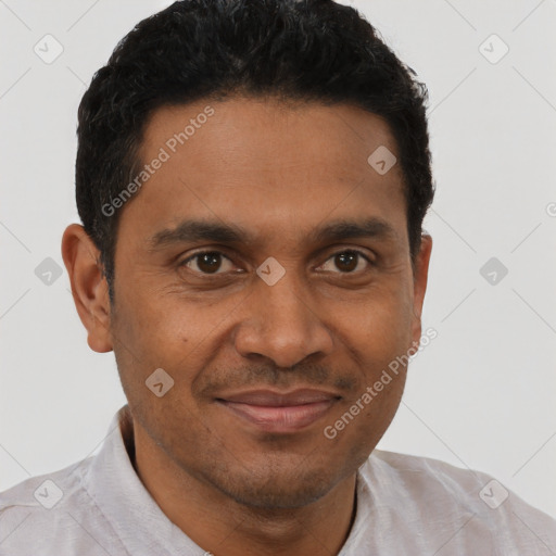 Joyful black young-adult male with short  brown hair and brown eyes