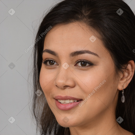 Joyful asian young-adult female with long  brown hair and brown eyes