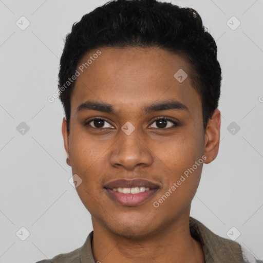 Joyful black young-adult male with short  black hair and brown eyes