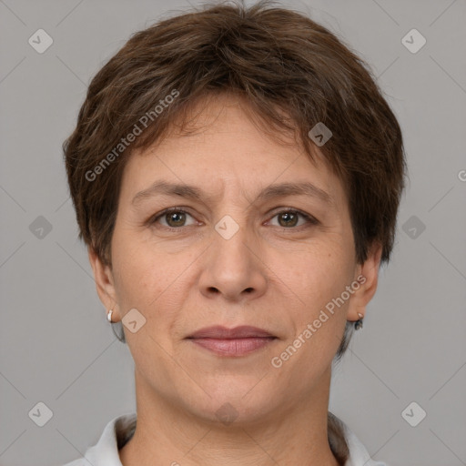 Joyful white adult female with short  brown hair and grey eyes