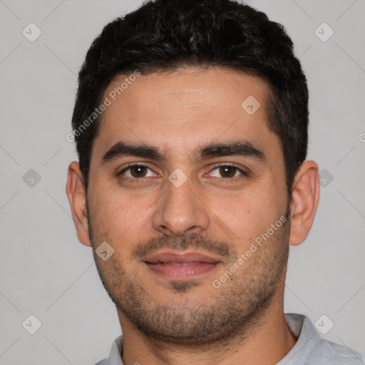 Joyful white young-adult male with short  black hair and brown eyes