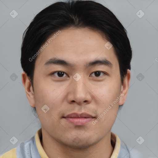 Joyful asian young-adult male with short  brown hair and brown eyes