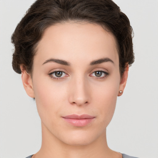 Neutral white young-adult female with short  brown hair and brown eyes