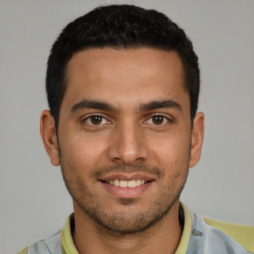 Joyful white young-adult male with short  brown hair and brown eyes