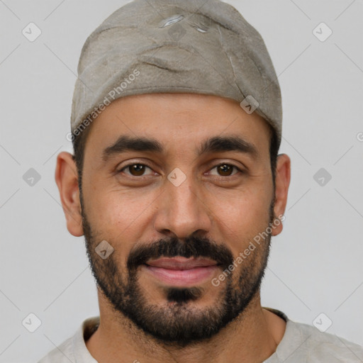 Joyful white young-adult male with short  black hair and brown eyes