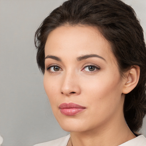 Neutral white young-adult female with medium  brown hair and brown eyes