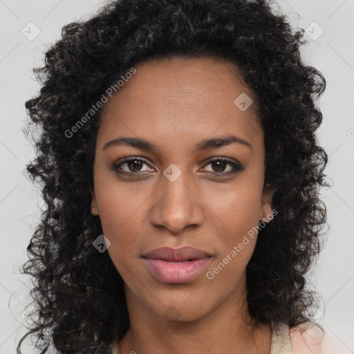 Joyful black young-adult female with long  brown hair and brown eyes