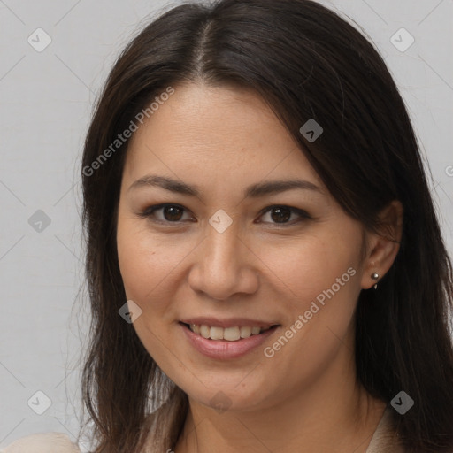 Joyful white young-adult female with long  brown hair and brown eyes