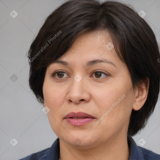 Joyful white adult female with medium  brown hair and brown eyes