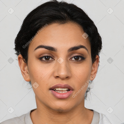 Joyful latino young-adult female with medium  brown hair and brown eyes