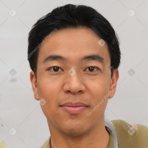 Joyful asian young-adult male with short  black hair and brown eyes