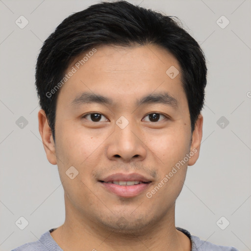 Joyful asian young-adult male with short  black hair and brown eyes