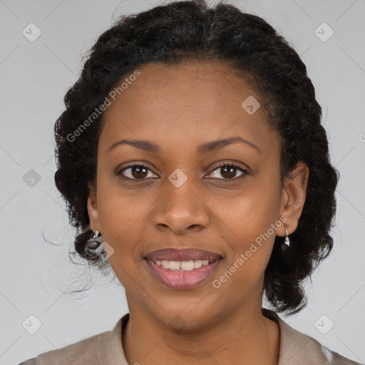 Joyful black adult female with medium  brown hair and brown eyes