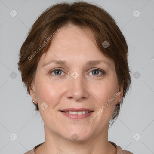 Joyful white adult female with medium  brown hair and grey eyes